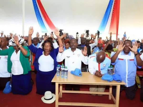 Ukambani leaders kneel for prayers during a meeting with Wiper leader Kalonzo Musyoka at Machakos Golf club on Friday, May 19, 2017. /ANDREW MBUVA