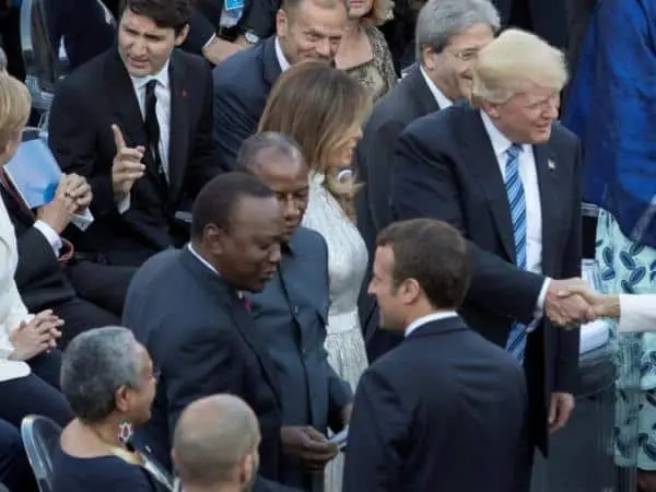 G7 leaders turn gaze to Africa, hold talks on migrant crisis. President Uhuru Kenyatta speaks with French President Emmanuel Macron before a concert by the La Scala Philharmonic Orchestra at the Ancient Greek Theatre of Taormina, Sicily, Italy, May 26, 2017. /REUTERS