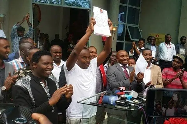 Popular musician Charles Njagua Kanyi, aka Jaguar, displays a copy of a nomination ruling in his favour on May 3, 2017 after the Jubilee Party Appeals Tribunal declared him the winner of Starehe constituency nominations. He had appealed an earlier declaration that showed MP Maina Kamanda had won the primaries. PHOTO | AGGREY MUTAMBO | NATION MEDIA GROUP