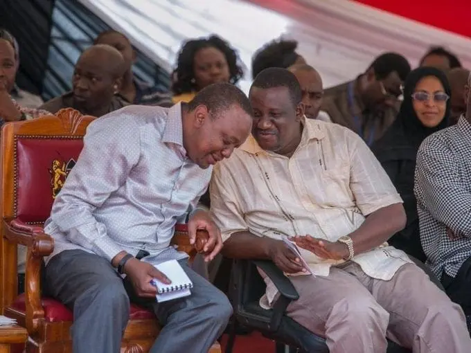 President Uhuru Kenyatta with Kwale Governor Salim Mvurya at Kikoneni Trading Centre in the county during a past tour. /FILE