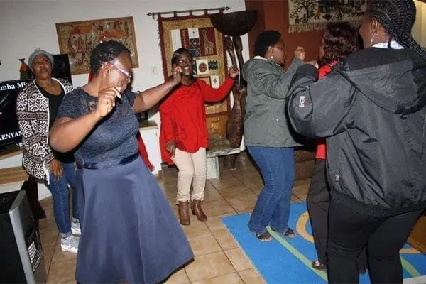 Corporate exploits of a Kenyan women’s group in South Africa 3 The members take to the floor to dance during