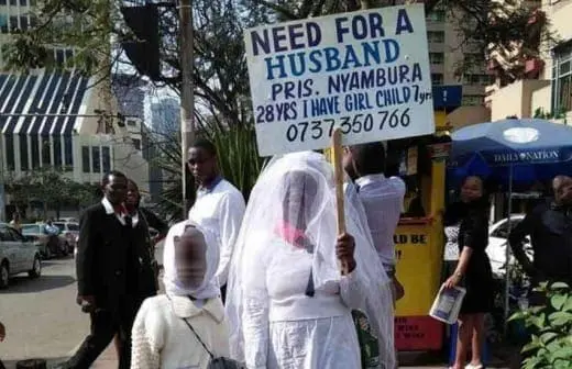 Kenyan woman looking for a mzungu husband using placard