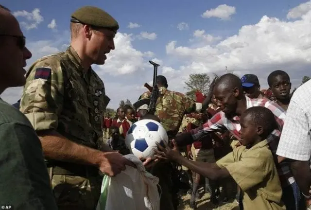 Prince William plays soccer with Kenyan youth during Africa tour