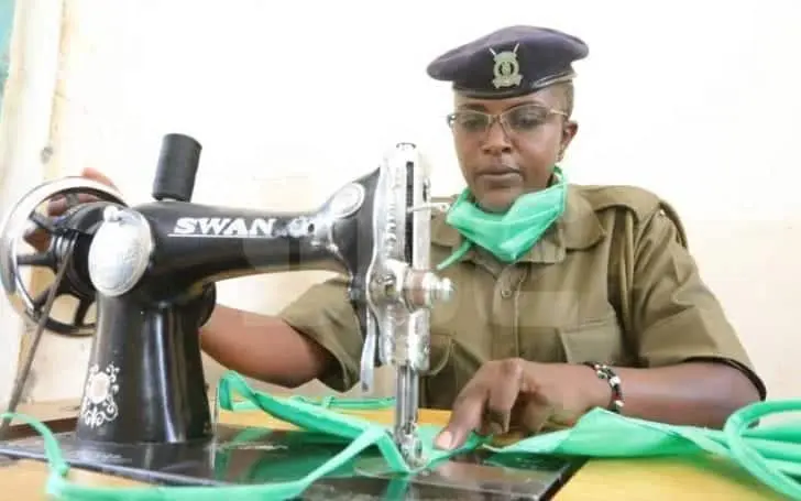 Police officer Caroline Makena making free masks for residents