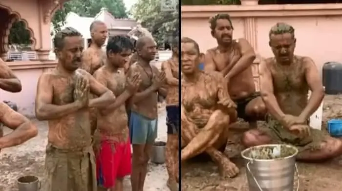 Locals In India Smear Cow Dung On Their Bodies To Fight Covid