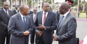 President Uhuru Kenyatta (centre) confers with Deputy President William Ruto (right) and Head of Public Service Francis Kimemia (left) at the Jomo Kenyatta International Airport (JKIA) before leaving for Addis Ababa, Ethiopia to attend a regional summit May 3, 2013. PPS