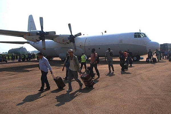 Civilians who were evacuated from South Sudan arrive at the Entebbe International Airport in Uganda on their way to Kampala on December 20, 2013. PHOTO | AFP
