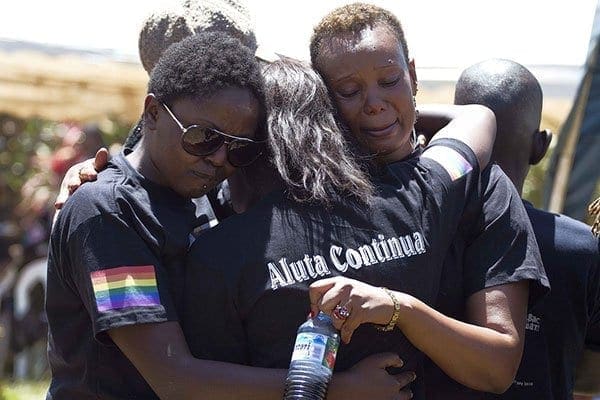 Members of the Ugandan gay community mourn at the funeral of murdered activist David Kato near Mataba, on January 28, 2011. The United States urged the Uganda government on Friday to “stop enactment” of the Anti-Homosexuality Bill approved by the country's parliament. AFP PHOTO/Marc Hofer