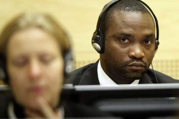 This November 24, 2009 file photo shows former Congolese warlord militiaman Germain Katanga sitting in the courtroom of the International Criminal Court in The Hague.  AFP PHOTO / MICHAEL KOOREN