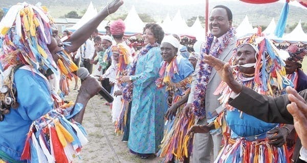 Wiper Democratic Movement Leader Kalonzo Musyoka and Kilome Constituency Member of Parliament Regina Ndambuki join Kanini Kaseo dancers at Mulumini Primary School grounds during Ndambukiâ€™s home-coming ceremony.  [PHOTO: DENNIS KAVISU / STANDARD]