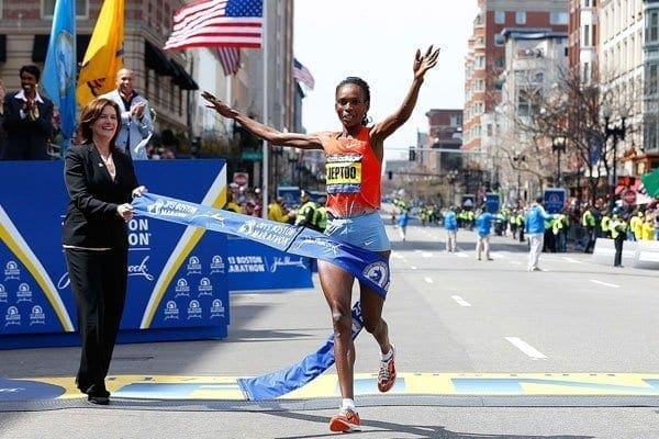 Rita Jeptoo of Kenya crosses the finish line to win the women's division of the 117th Boston Marathon on April 15, 2013 in Boston, Massachusetts.  Ms Jeptoo will lead star-studded team of elite runners from Kenya in this year’s Boston Marathon.  Jim Rogash/Getty Images/AFP