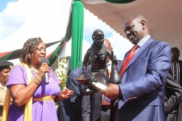 Murang'a county women representative Sabina Chege, left, presents a sculpture gift to Deputy President William Ruto during a thanksgiving ceremony for her and a fundraiser towards women groups at Kenol town in Murang'a on April 12, 2014. Photo/JOSEPH KANYI