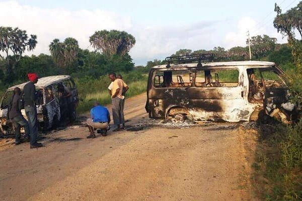 Wreckage of two burnt vehicles on a roadside in Mpeketoni, Lamu County, after some 50 heavily-armed gunmen attacked the town on June 16, 2014.   AFP PHOTO/STRINGER