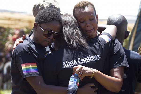 Members of the Ugandan gay community mourn at the funeral of murdered activist David Kato near Mataba, on January 28, 2011. The World Bank stalled a $90 million loan planned to help Uganda strengthen its health care system on Thursday after the country put in place a harsh anti-gay law. PHOTO/FILE