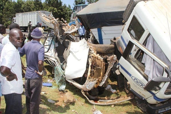 Members of the public at the road crash scene where three people, including two senior Uasin Gishu County staff died at Outspan on the Eldoret-Nakuru highway. PHOTO | JARED NYATAYA | NATION MEDIA GROUP.