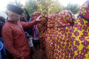 Nominated MP Isaac Mwaura identifies his fiancee in a parade of heavily covered women during the bride price ceremony in Embu.