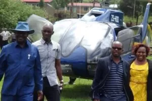BRAND NEW: Raila and his new political aide Silas Jakakimba (second right) arrive at Kitoben AGC church yesterday. They have just disembarked from one of his new helicopters. Photo/Sonu Tanu 