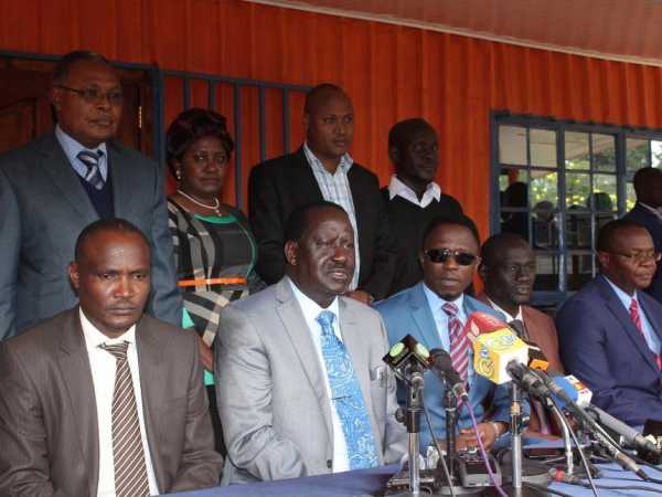 ODM national chairman John Mbadi, party leader Raila Odinga and secretary general Ababu Namwamba with other officials during a press conference at Orange House yesterday / COLLINS KWEYU