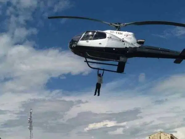 Saleh Wanjala hanging on the helicopter in BungomaPHOTOS/FILE