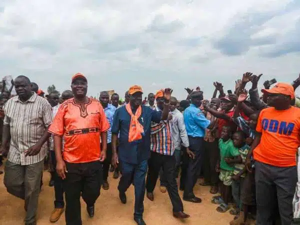 Cord leader Raila Odinga arrives in Malaba for a public rally during his tour of the western region on Thursday. Accompanying is Busia Governor Sospeter Ojamoong.