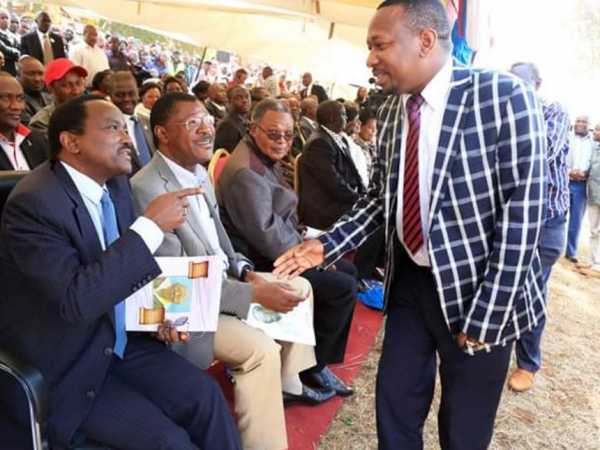 Wiper leader Kalonzo Musyoka talking to Nairobi senator Mike Sonko during the burial ceremony of Mavoko MP father.Photo/courtesy