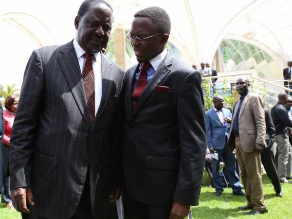 CORD leader Raila Odinga and Ababu Namwamba chat after a parliamentary group meeting at the Boma hotel on July 22 2014 .Photo/File