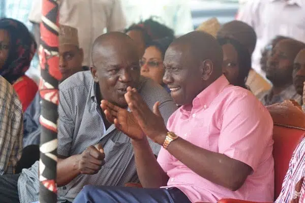 Deputy President William Ruto (right) chats with Kilifi North MP Gideon Mung'aro at Dr Kraph GroundS in Rabai for a funds drive for women's group. PHOTO | KAZUNGU SAMUEL | NATION MEDIA GROUP
