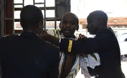 Nyeri County Assembly security guards restrain a ward representative involved in a brawl over a motion to impeach Governor Nderitu Gachagua on August 23, 2016.