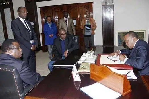 Presdident Uhuru Kenyatta signs a Bill into law. Photo | PSCU
