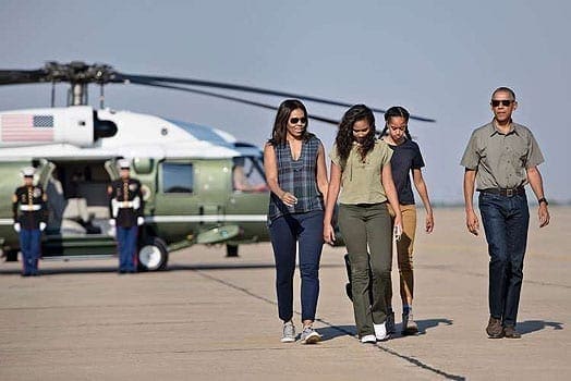 US first lady Michelle Obama with daughters Sasha and Malia and President Barack Obama walk to board Air Force One at Roswell International Air Center on June 17, 2016 in Roswell, New Mexico. AFP | PHOTO