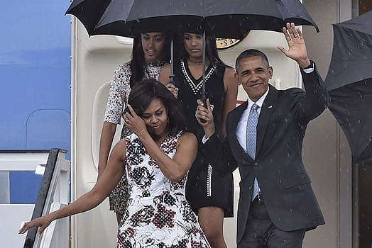 US President Barack Obama waves next to First Lady Michelle Obama (L) and their daughters Malia (L, behind) and Sasha upon their arrival at Jose Marti international airport in Havana on March 20, 2016. PHOTO | AFP