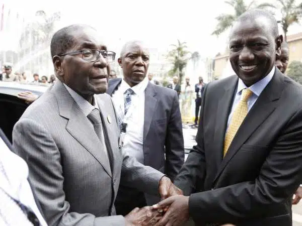 Deputy President William Ruto receives Zimbabwe President Robert Mugabe when he arrived for the TICAD conference, Nairobi. /DPPS