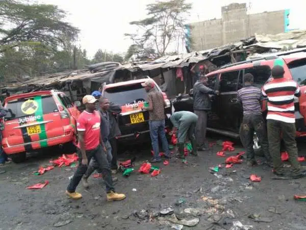 Technicians strip cars with Jubilee Party labels after the launch on Saturday, September 10. /COURTESY