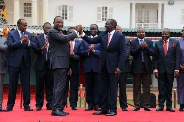 President Uhuru Kenyatta (front left) with his deputy William Ruto and officials of political parties that will merge to form the Jubilee Party at State House in Nairobi on August 9, 2016.