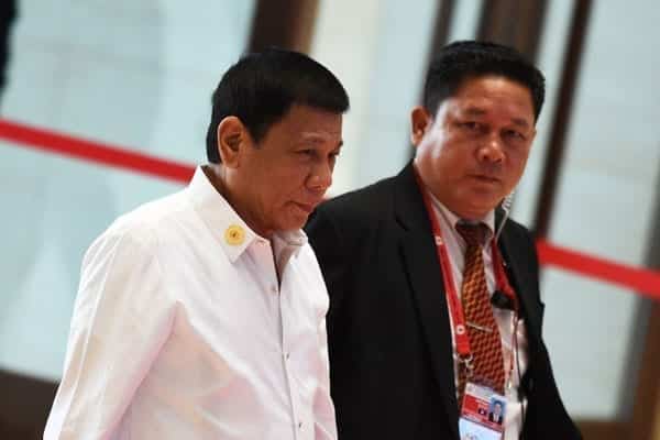 Philippine President Rodrigo Duterte (left) arrives at the convention centre to attend the 28th and 29th Association of Southeast Asian Nations (ASEAN)in Vientiane on September 6, 2016. Duterte expressed regret for a tirade against Barack Obama in which he called the US leader a 