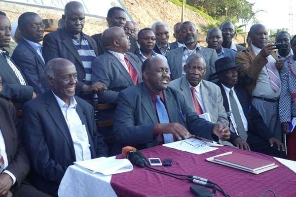 Gema chairman Bishop Lawi Imathiu (left) and Kamba Clans Governing Council chairman Boniface Kilonzo exchange copies of resolutions reached at the Masinga Dam Resort on September 16, 2016.