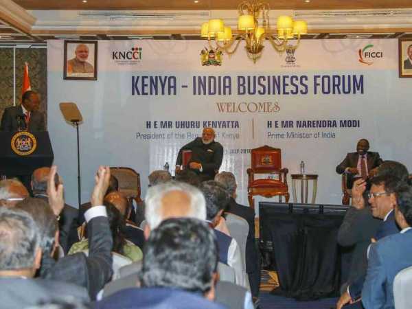 President Uhuru Kenyatta addresses the Kenya-India Business Forum at a Nairobi Hotel as India Prime Minister Narendra Modi and Deputy President William Ruto look on, July 2016. /FILE