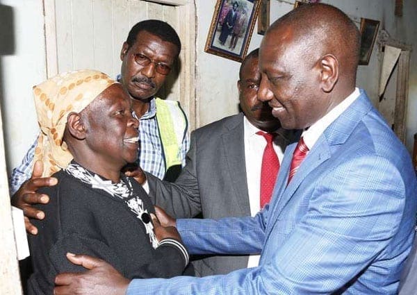 Deputy President William Ruto speaks to Anne Walelal after he launched the Last Mile Connectivity Project at Mois Bridge Likuyan in Kakamega on October 1, 2016. He has threatened to sue Boniface Mwangi for defamation. PHOTO | DPPS