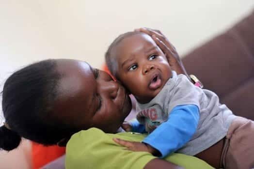 Baby Donald Trump Otieno plays with a handler Martha Osino at their house in Lolwe Kisumu. Parents of baby Trump named him after US president elect whom they admire. PHOTO | TOM OTIENO