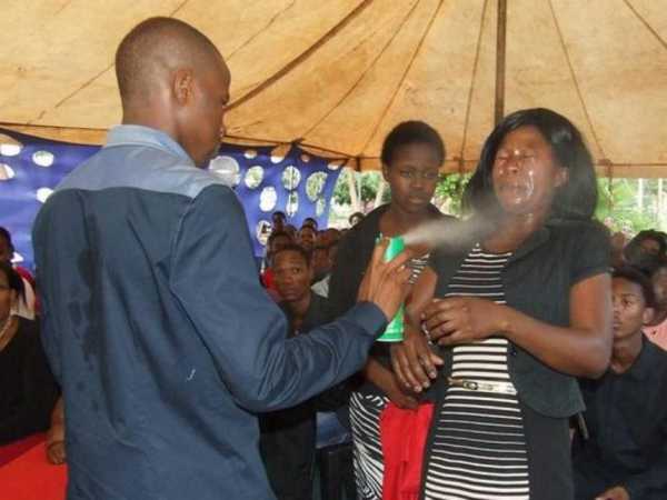Prophet Lethebo Rabalago sprays Doom on a congregant at Mount Zion General Assembly (MZGA) account./Courtesy