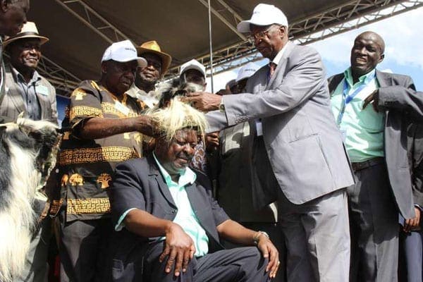 Amani National Congress leader Musalia Mudavadi (seated) when he was installed Luhyia spokesperson by Western Council of Elders chairman Philip Masinde (right) and Nabongo Peter Mumias at Bukhungu Stadium, Kakamega on December 31, 2016.  PHOTO ISAAC WALE | NATION MEDIA GROUP