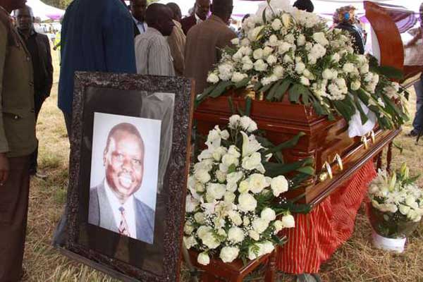 Mourners view the body of former nominated MP