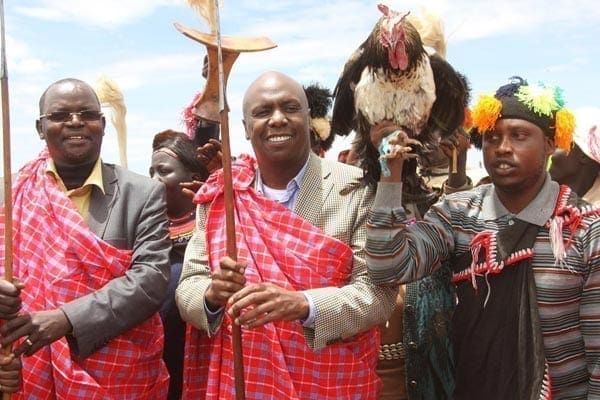 Kanu chairman Gideon Moi joins Benson Chesimbolia and other Kapsangar dancers in a jig during a fundraiser in aid of Kalya Primary School in West Pokot County on March 27, 2015. Bomet Governor Isaac Ruto now says Kanu is a more natural home for Rift Valley voters than the Jubilee Alliance Party (JAP). PHOTO | JARED NYATAYA |