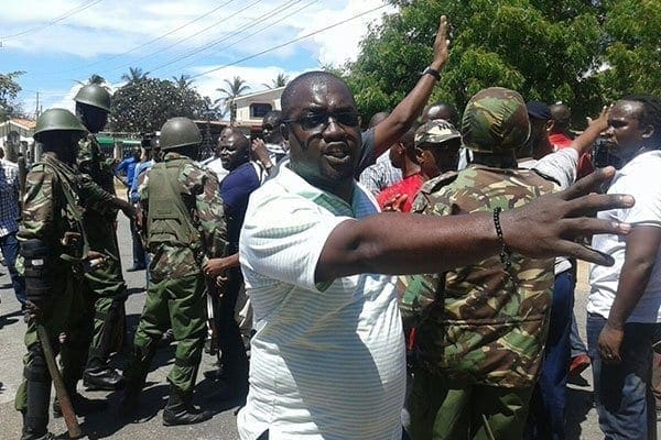 Mr Joho's supporters protest after being