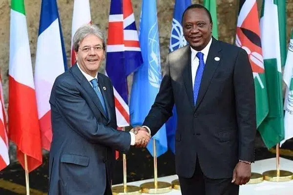 Italian Prime Minister Paolo Gentiloni (left) welcomes Kenya's President Uhuru Kenyatta