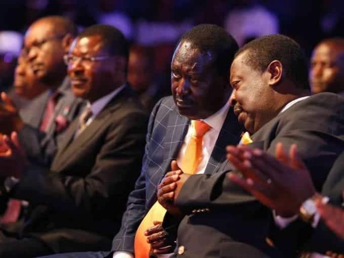 NASA presidential candidate Raila Odinga confers with Musalia Mudavadi of Amani National Congress during the launch of their manifesto in Nairobi, June 27, 2017. /JACK OWUOR