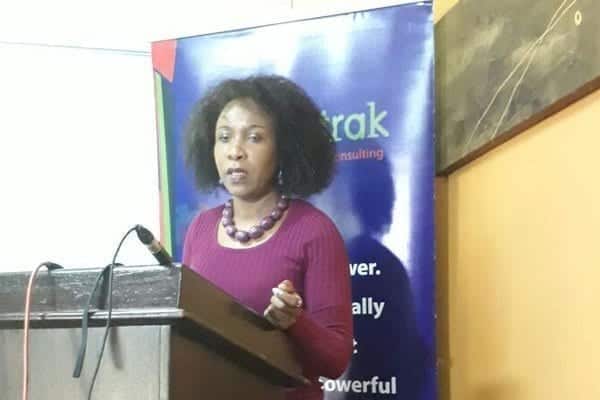 Infotrak head Angela Ambitho releasing the latest opinion poll results