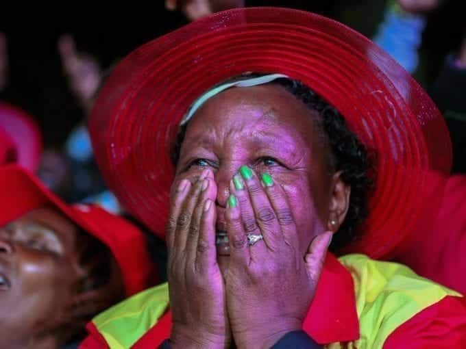 A supporter of incumbent President Uhuru Kenyatta reacts after he was announced winner of the presidential election in Nairobi, Kenya August 11, 2017. /REUTERS