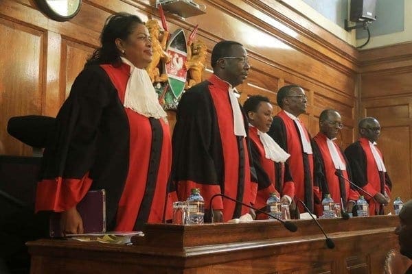 Supreme Court justices line up on Tuesday. Mr Raila Odinga, declared loser of the August 8 election by the electoral commission, is challenging the re-election of President Uhuru Kenyatta. A ruling is expected to be read in Nairobi on Friday. PHOTO | JEFF ANGOTE | NATION MEDIA GROUP