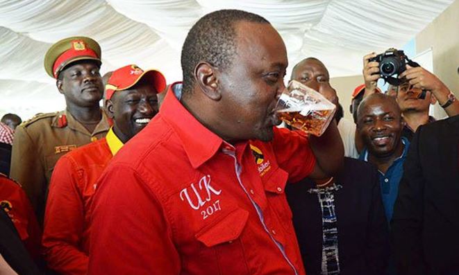 PHOTOS: Excitement as Uhuru Drinks a Whole Mug of ‘Jug Daniels’